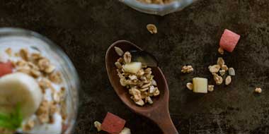 Wooden spoon with granola.