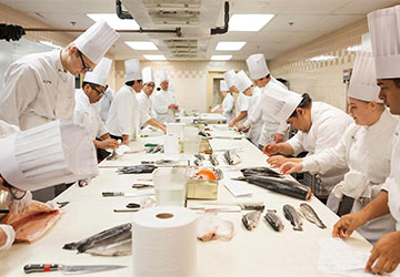 CIA ACAP students in the kitchen.