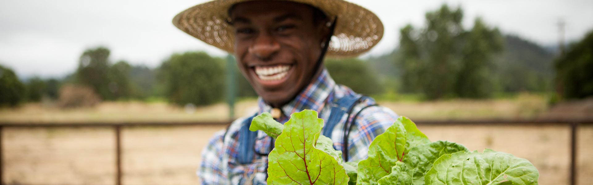 Smiling CIA master's degree student on a farm.