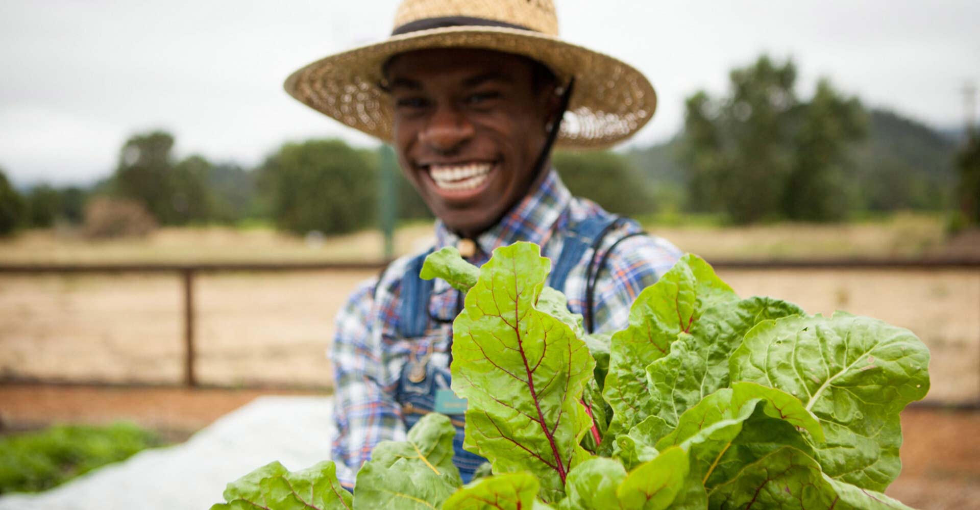 Smiling CIA master's degree student on a farm.