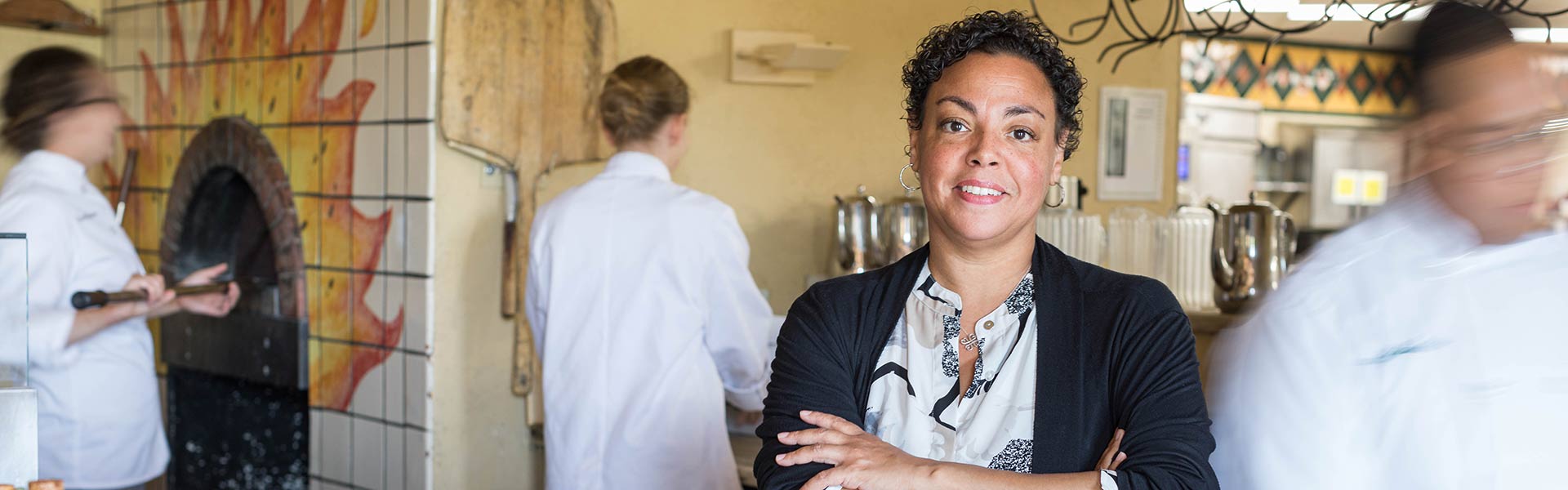 Manager in the kitchen of a food business.