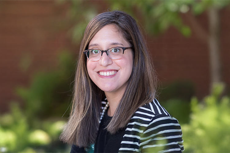 Image of Rebecca Rein, Graduate Admissions and Enrollment Counselor standing outside.