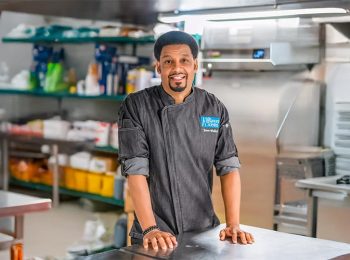 Jason Wallace ’20, The Restaurant Scientist standing in a kitchen.