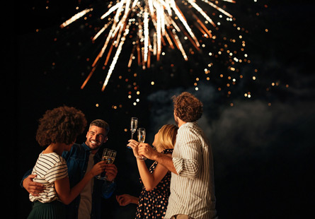 June 15 Application Deadline People celebrating applying for CIA master’s program with fireworks at night.